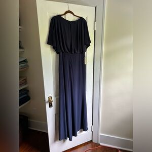 Beautiful navy blue dress.  Simple classic flowing with slit on one side.